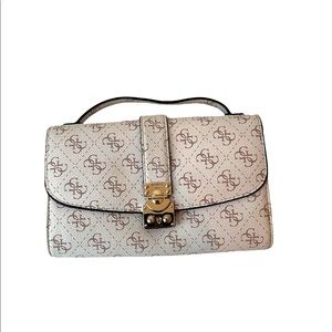 Cream color and white Guess wallet/clutch